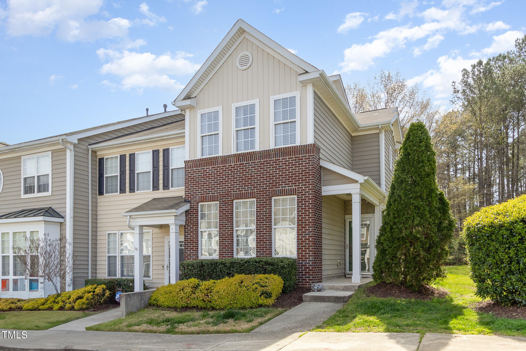 7621 Satinwing Lane Raleigh, NC 27617 - Photo 1 of 23 a front view of a house with garden
