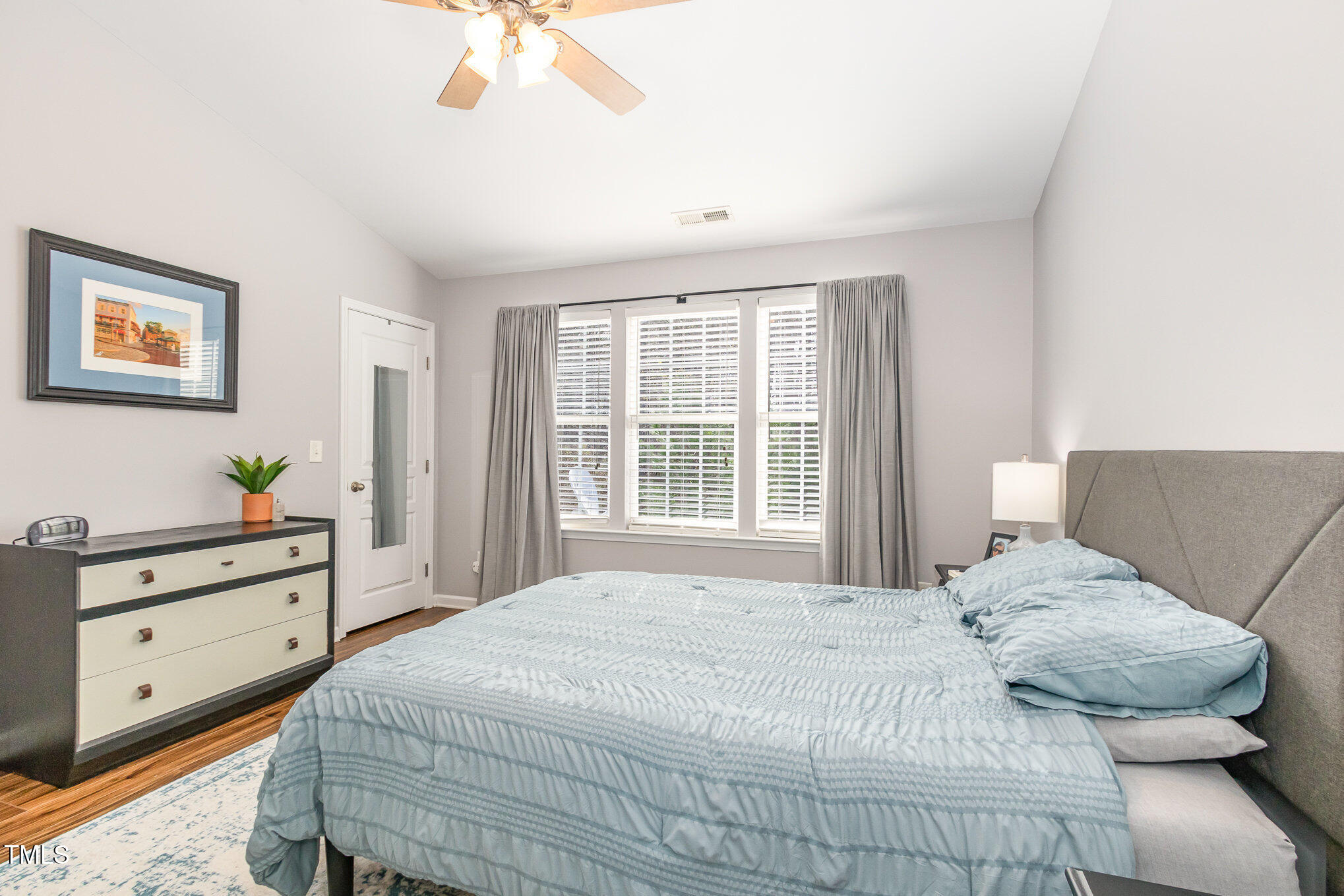 7621 Satinwing Lane Raleigh, NC 27617 - Photo 13 of 23 a bedroom with a bed and a window