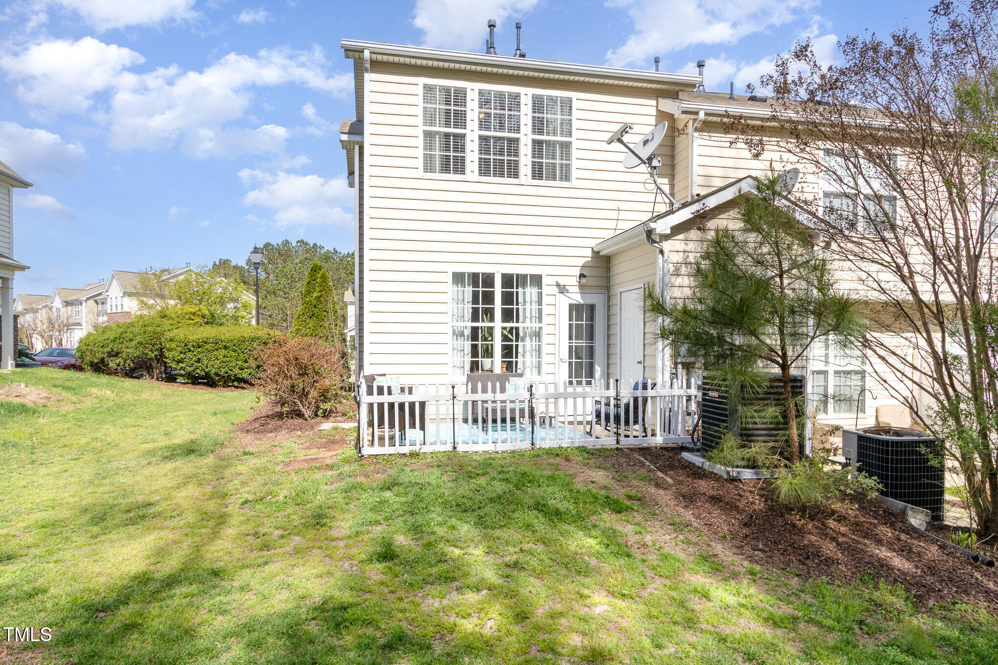 7621 Satinwing Lane Raleigh, NC 27617 - Photo 19 of 23 a front view of a house with a garden