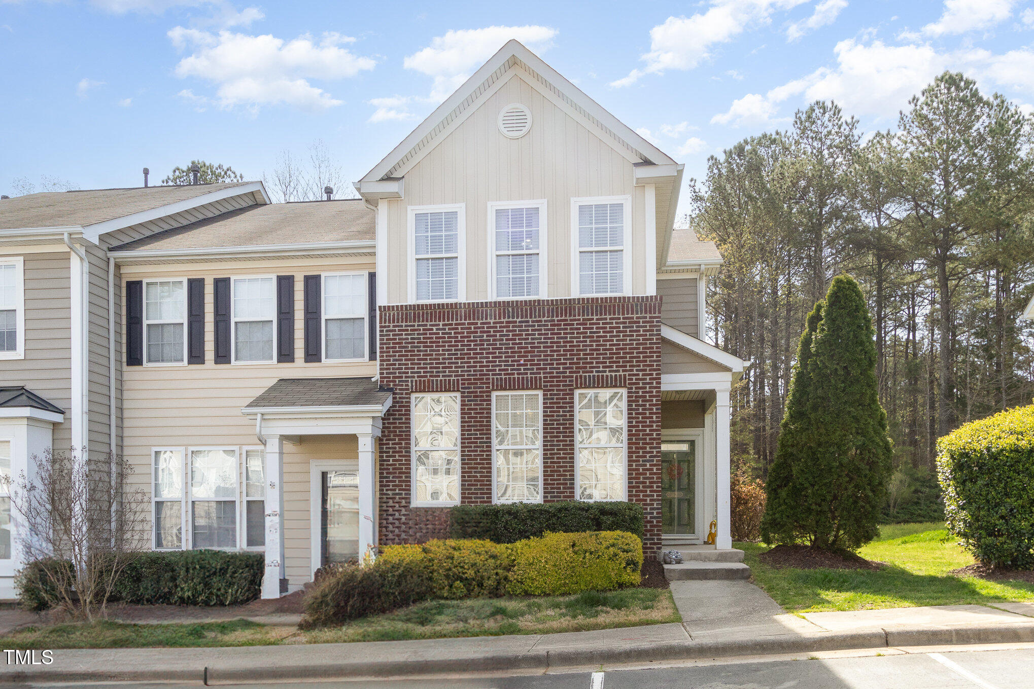 7621 Satinwing Lane Raleigh, NC 27617 - Photo 22 of 23 a front view of a house with a yard