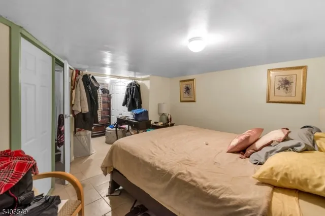 a bed room with a bed and a view of bedroom