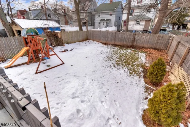 a view of a backyard with a bench