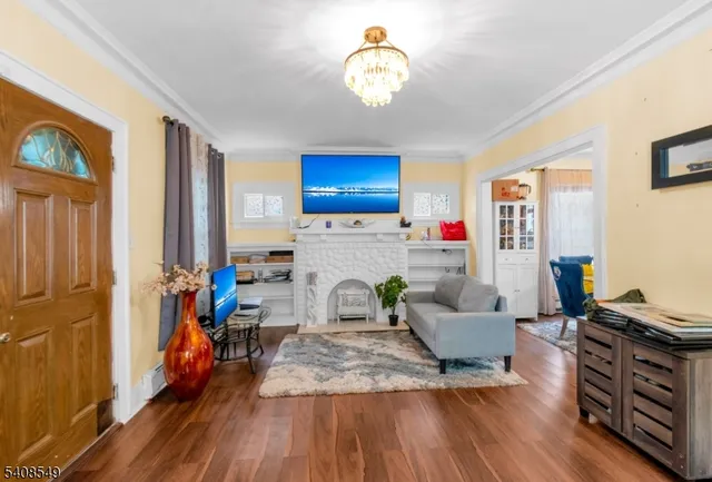 a living room with fireplace furniture and a flat screen tv