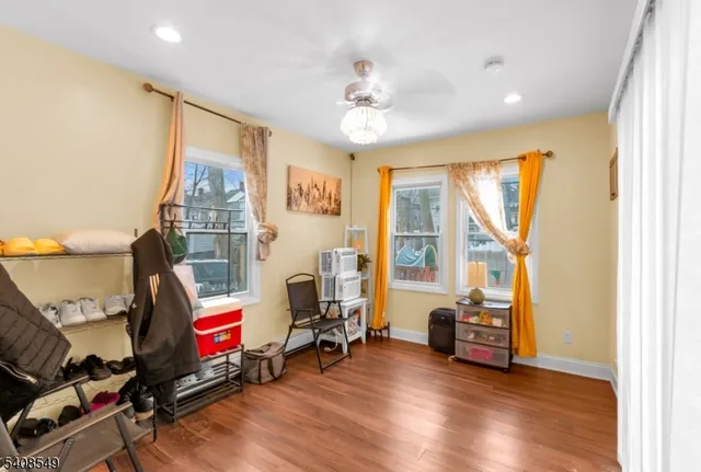 a view of a livingroom with workspace and a window