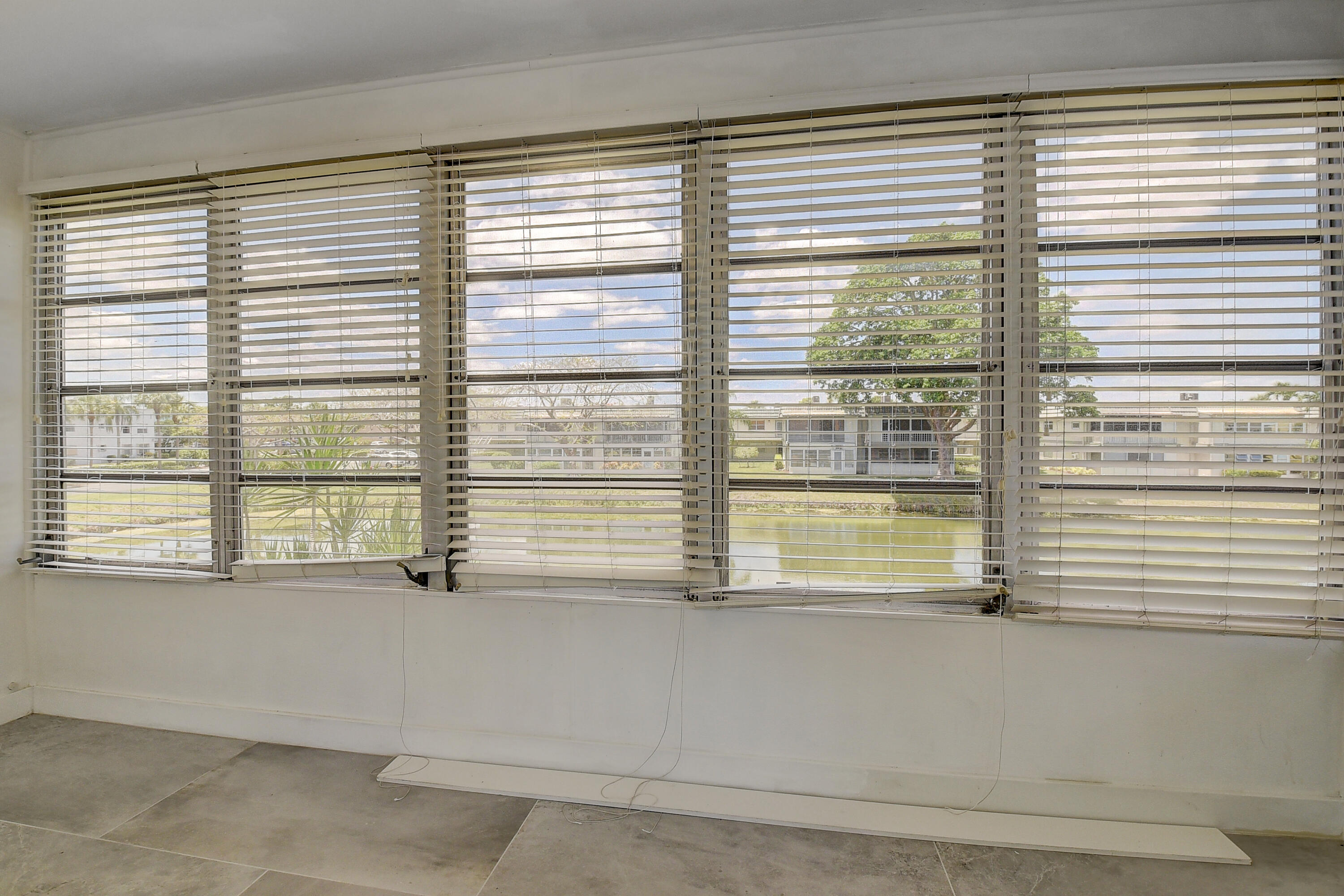 318 Monaco Boulevard, Unit G Delray Beach, FL 33446 - Photo 21 of 31 a view of an empty room with a window