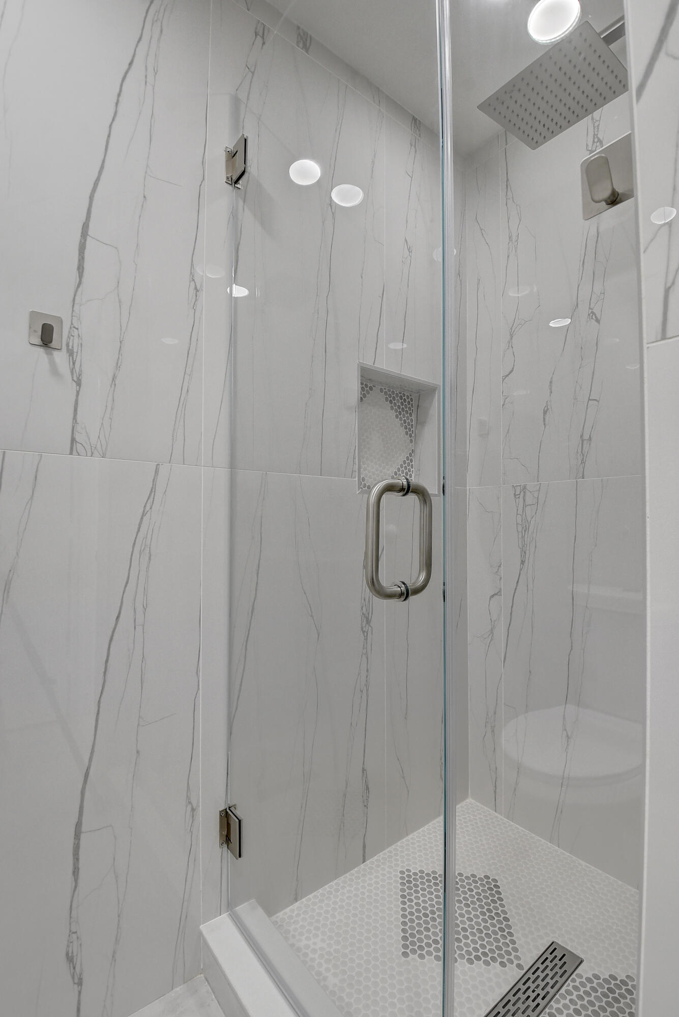 318 Monaco Boulevard, Unit G Delray Beach, FL 33446 - Photo 24 of 31 a bathroom with a shower