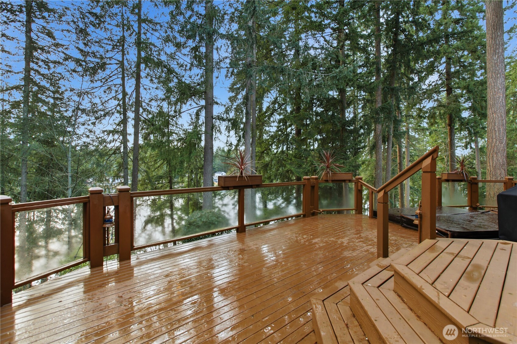25305 Southeast 232nd Street Maple Valley, WA 98038 - Photo 22 of 33 a view of a balcony with chairs and wooden floor