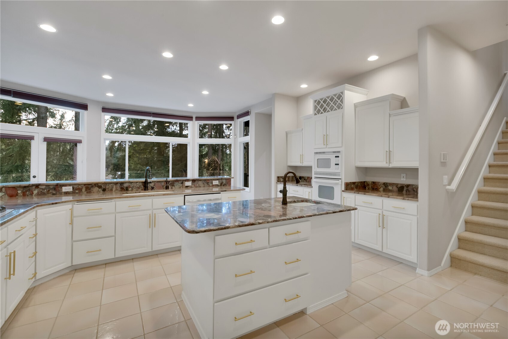 25305 Southeast 232nd Street Maple Valley, WA 98038 - Photo 23 of 33 a kitchen with counter top space sink and stainless steel appliances