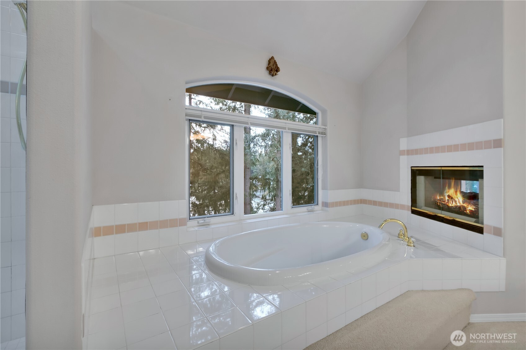25305 Southeast 232nd Street Maple Valley, WA 98038 - Photo 28 of 33 a bathroom with a bathtub and a window