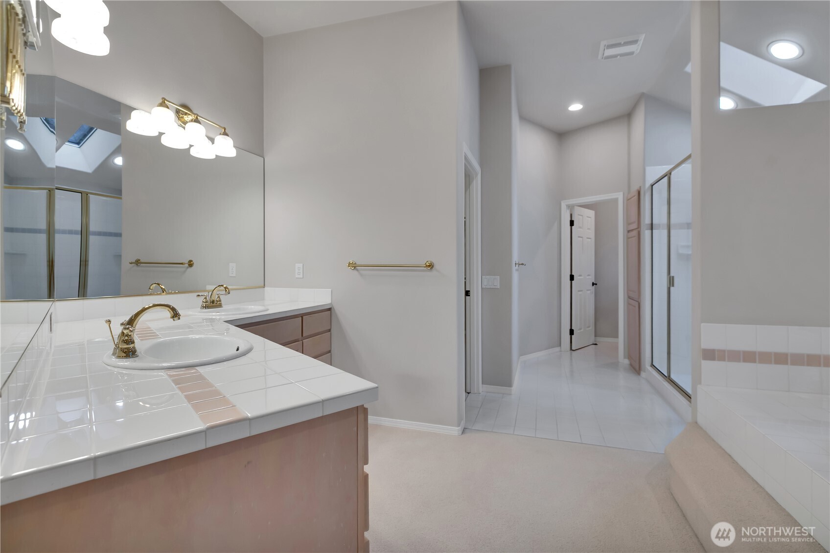 25305 Southeast 232nd Street Maple Valley, WA 98038 - Photo 29 of 33 a bathroom with a sink a light fixture and a mirror