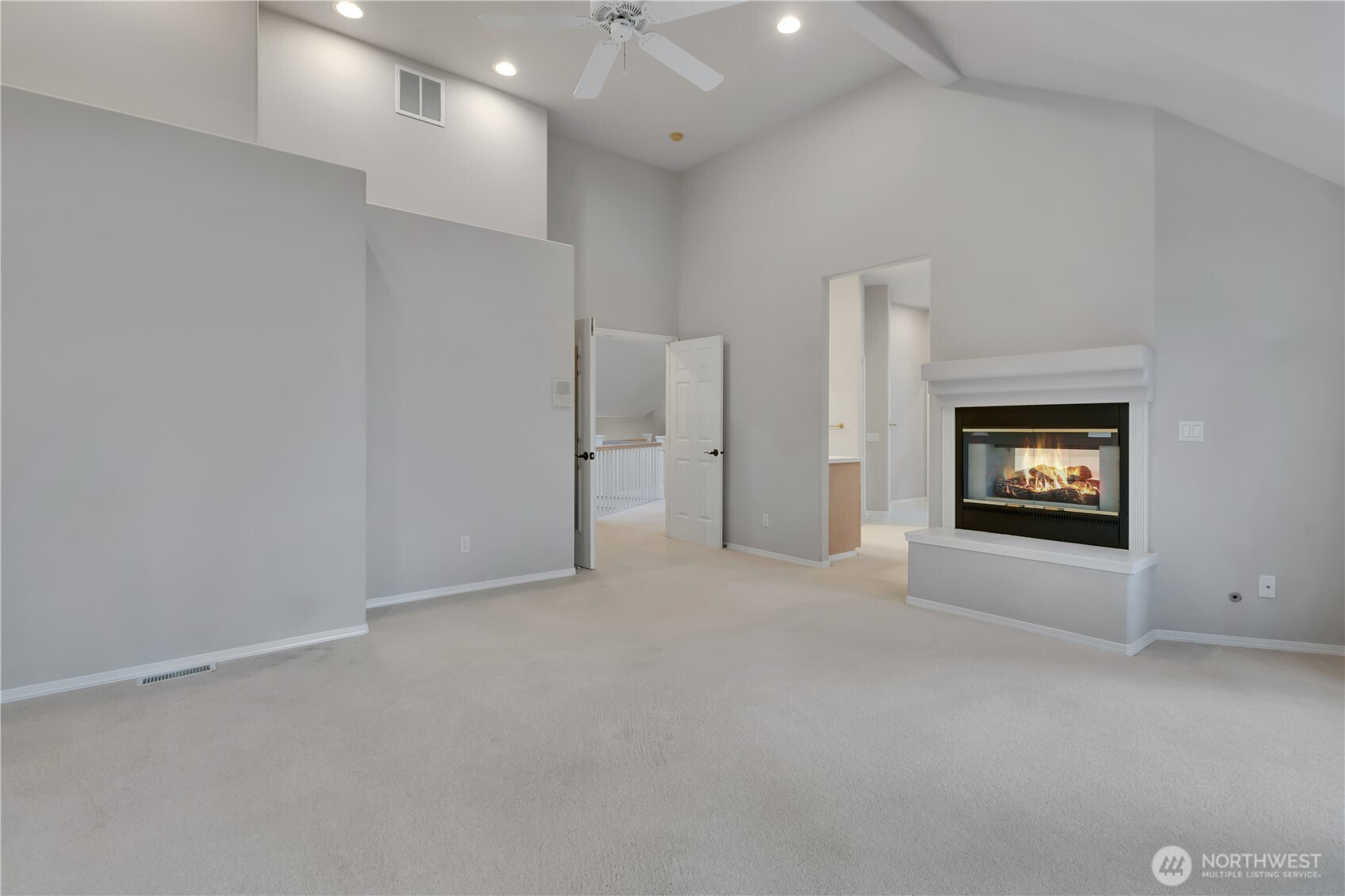 25305 Southeast 232nd Street Maple Valley, WA 98038 - Photo 10 of 33 an empty room with windows and fireplace