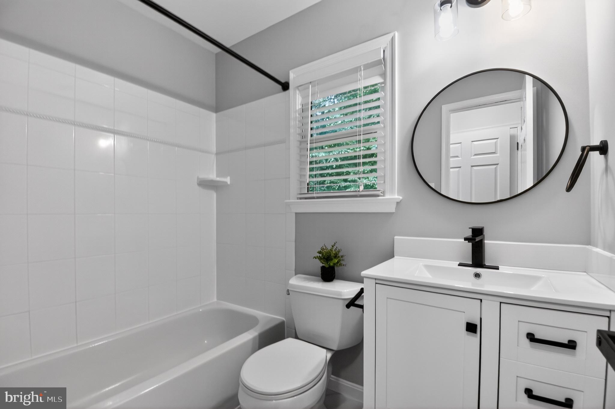 11728 Stuart Mill Road Oakton, VA 22124 - Photo 40 of 68 Modern bathroom with sleek finishes.