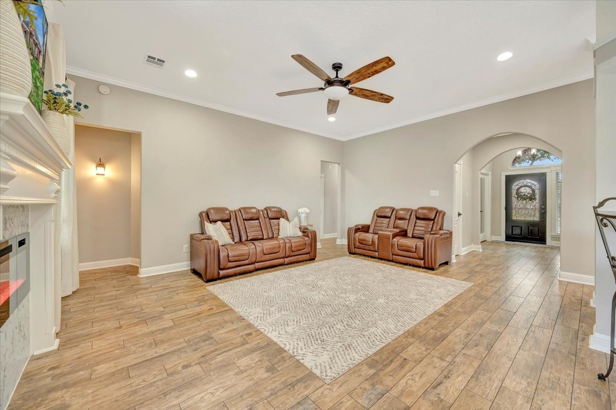 306 Sunset Ridge Drive League City, TX 77573 - Photo 15 of 50 a spacious bedroom with a bed and a chandelier