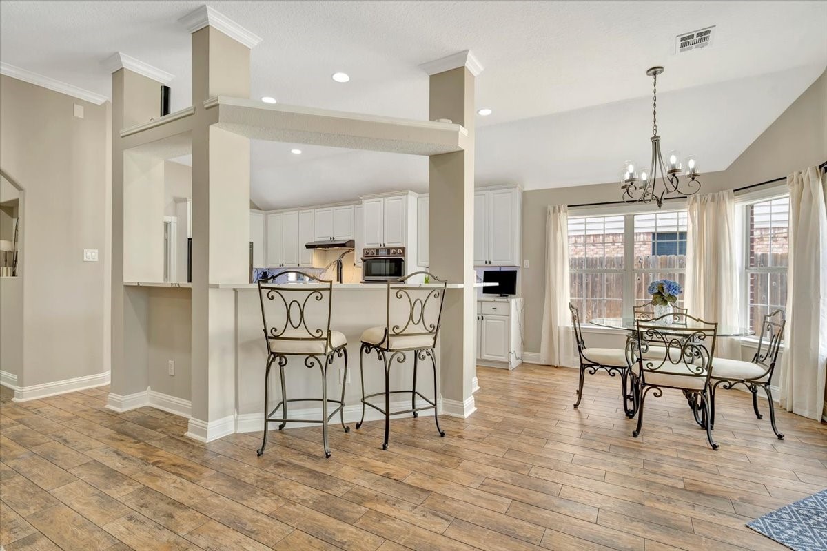 306 Sunset Ridge Drive League City, TX 77573 - Photo 16 of 50 a dining room filled with furniture and wooden floor