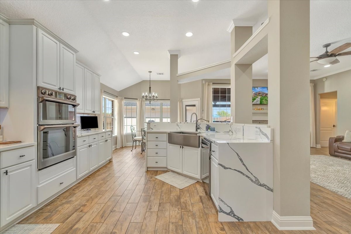 306 Sunset Ridge Drive League City, TX 77573 - Photo 20 of 50 a large white kitchen with stainless steel appliances