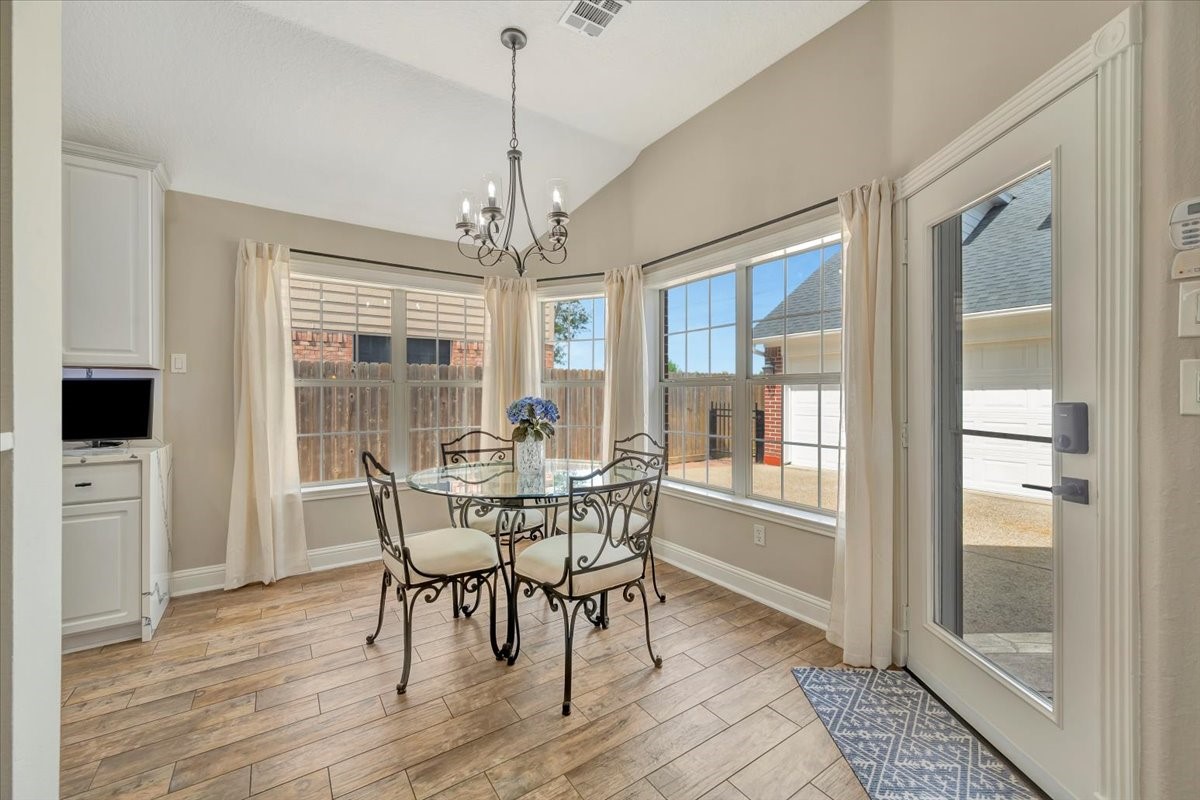 306 Sunset Ridge Drive League City, TX 77573 - Photo 21 of 50 a view of a dining room with furniture window and wooden floor