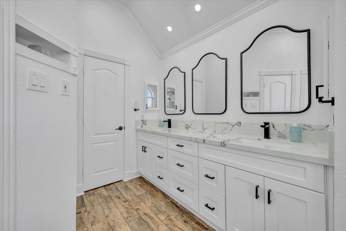 306 Sunset Ridge Drive League City, TX 77573 - Photo 23 of 50 a bathroom with a double vanity sink and mirror