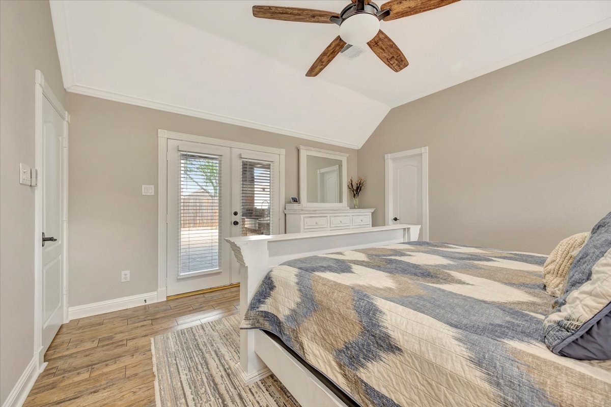 306 Sunset Ridge Drive League City, TX 77573 - Photo 25 of 50 a bed room with a bed and a chandelier