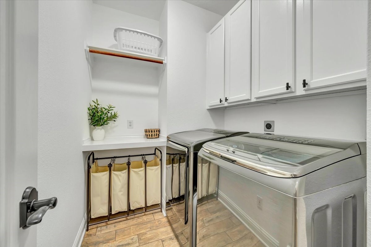 306 Sunset Ridge Drive League City, TX 77573 - Photo 26 of 50 a utility room with dryer and washer
