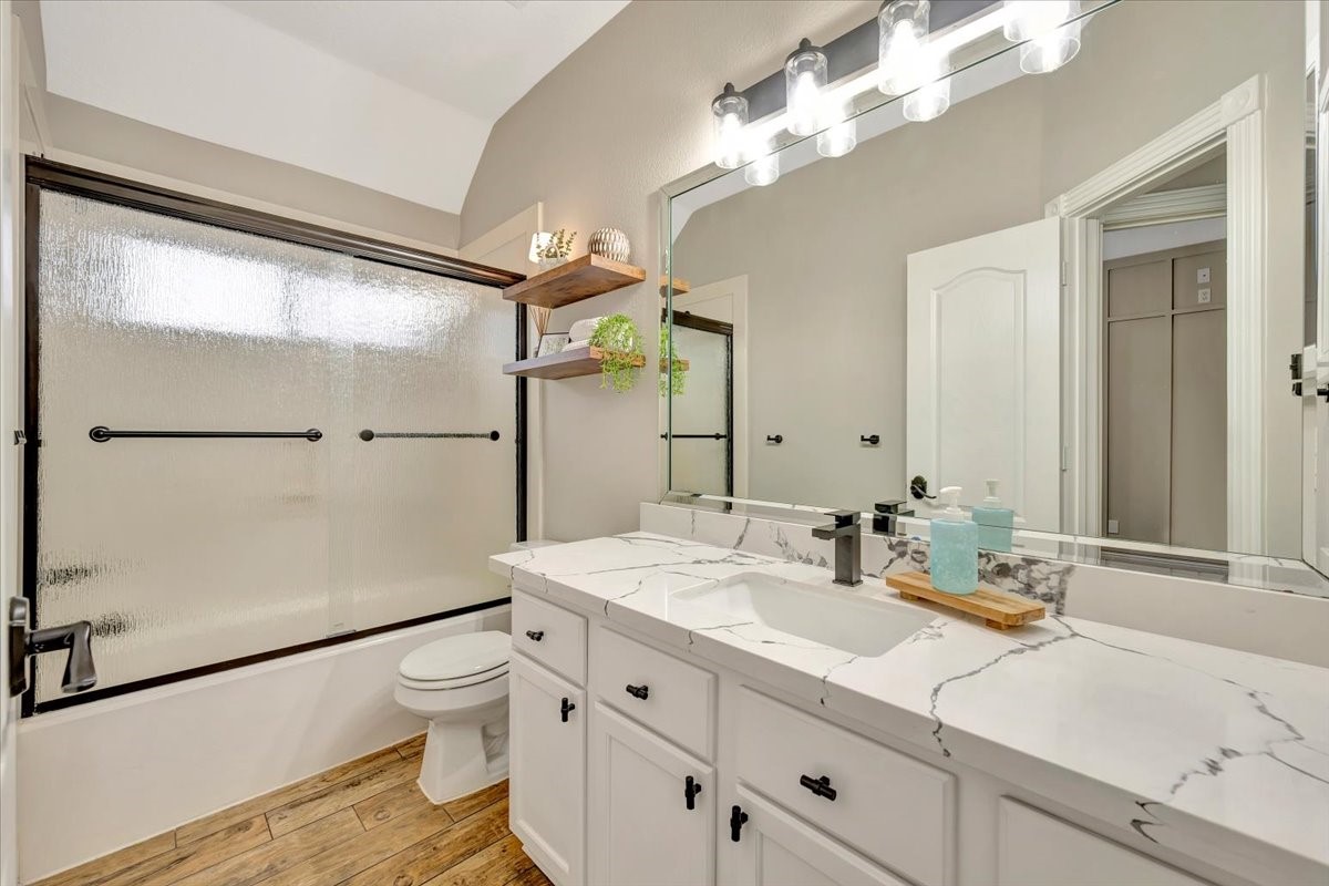 306 Sunset Ridge Drive League City, TX 77573 - Photo 28 of 50 a bathroom with a sink a toilet a mirror and shower