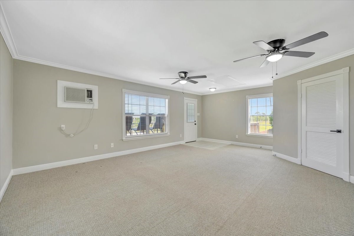 306 Sunset Ridge Drive League City, TX 77573 - Photo 34 of 50 a view of an empty room with a window