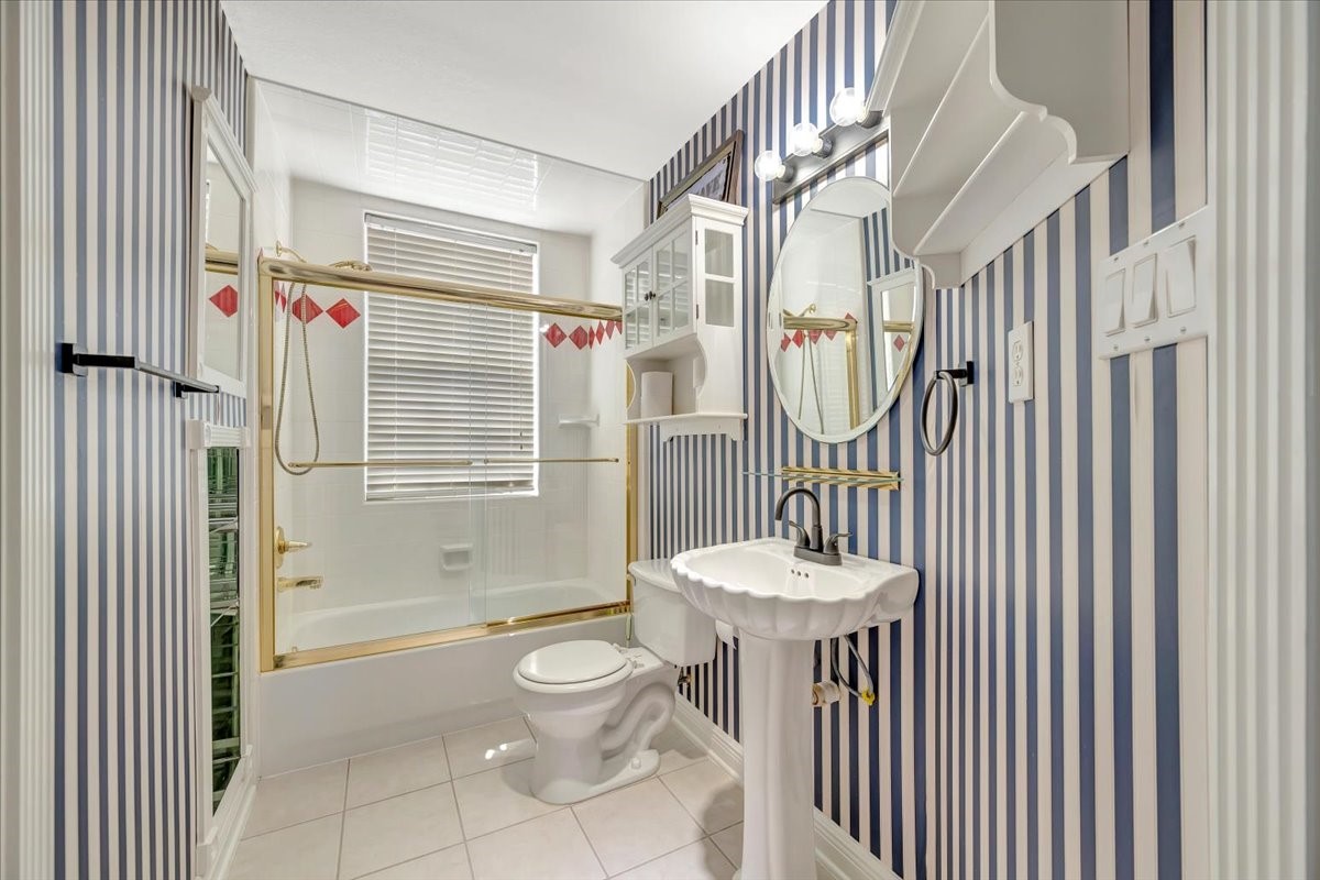 306 Sunset Ridge Drive League City, TX 77573 - Photo 35 of 50 a bathroom with a toilet sink and shower