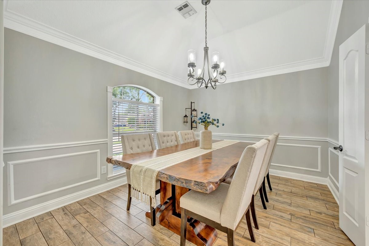 306 Sunset Ridge Drive League City, TX 77573 - Photo 8 of 50 a view of a dining room with furniture window and wooden floor