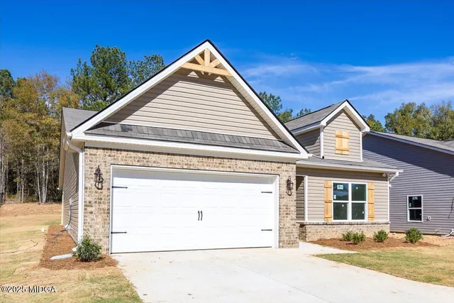 a view of house with yard