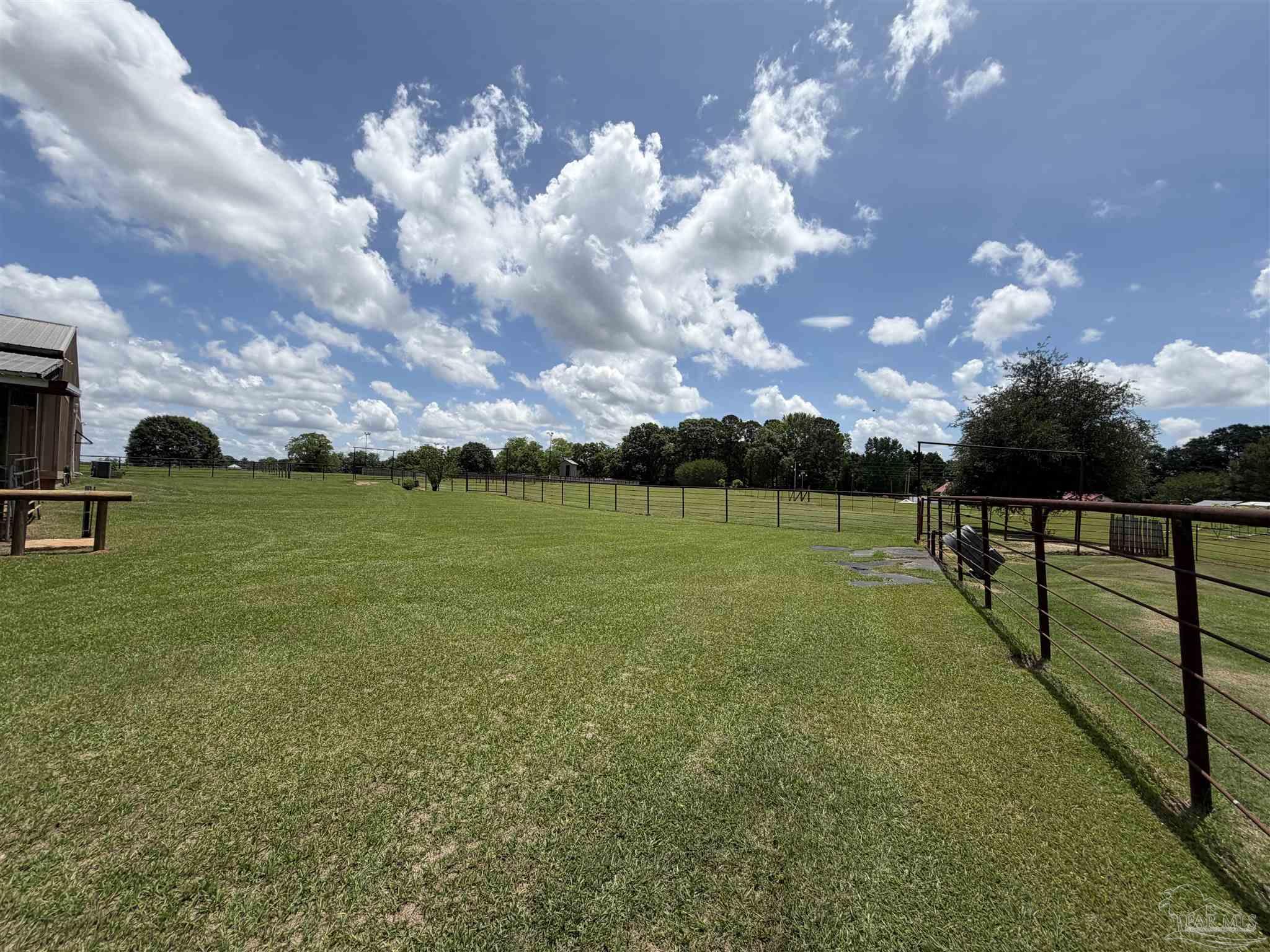 145 Tower Road Uriah, AL 36480 - Photo 50 of 72 a view of a garden with sitting area
