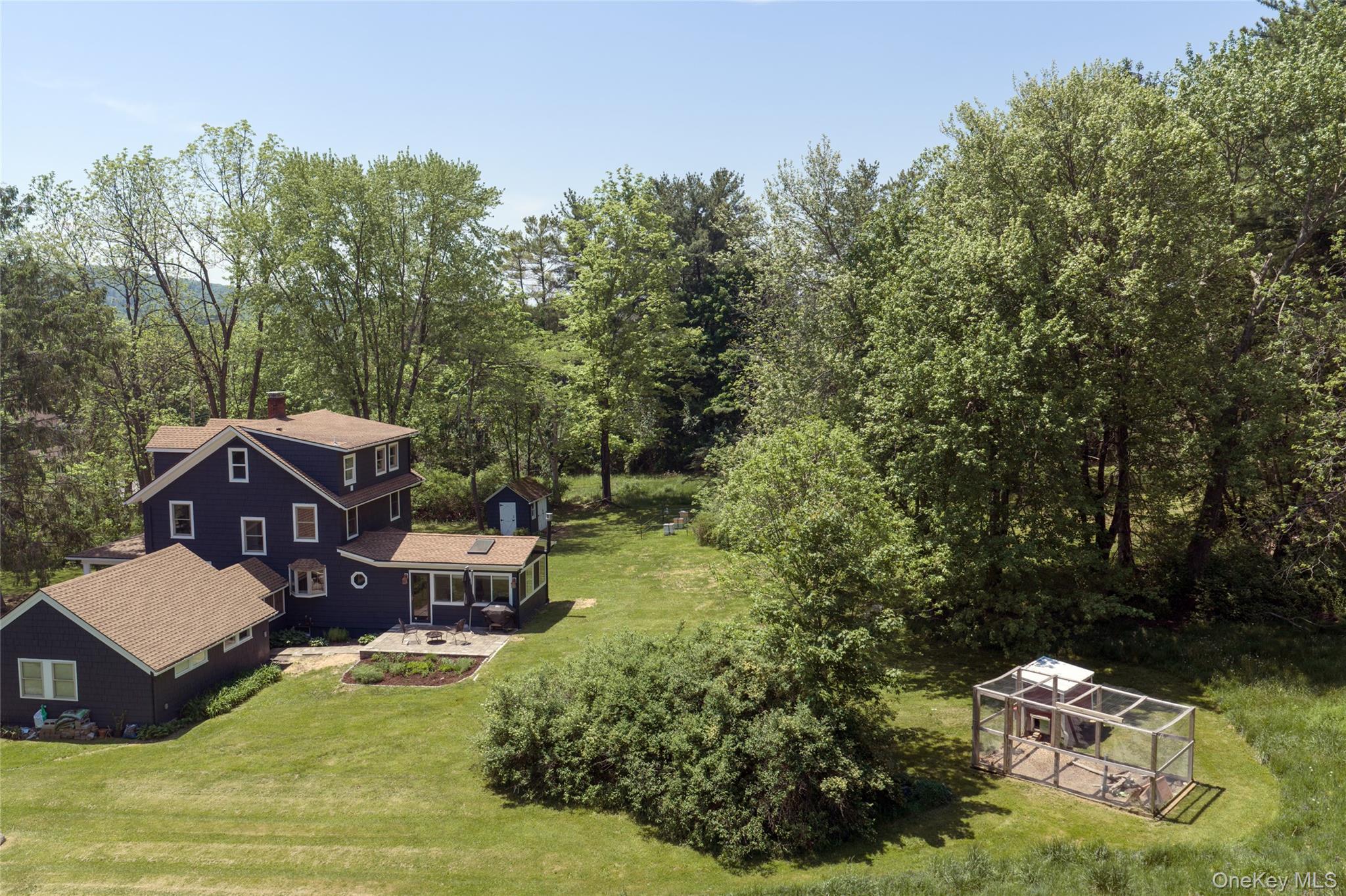 185 Verbank Village Road Millbrook, NY 12545 - Photo 22 of 22 a aerial view of a house with swimming pool and sitting area