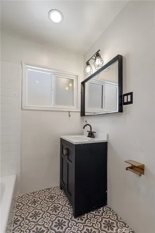 a bathroom with a double vanity sink and a mirror