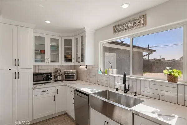 a bathroom with a shower and a sink mirror