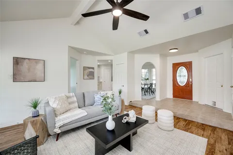 a living room with furniture and a table