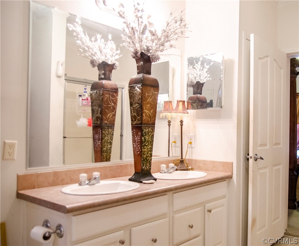 2861 Gold Mine Road Palmyra, VA 22963 - Photo 20 of 32 a bathroom with a double vanity sink and a mirror