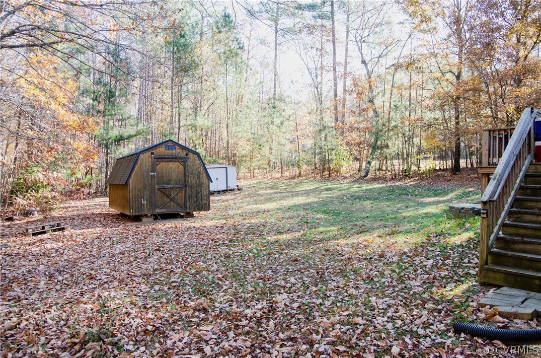 2861 Gold Mine Road Palmyra, VA 22963 - Photo 32 of 32 a view of a backyard with large trees
