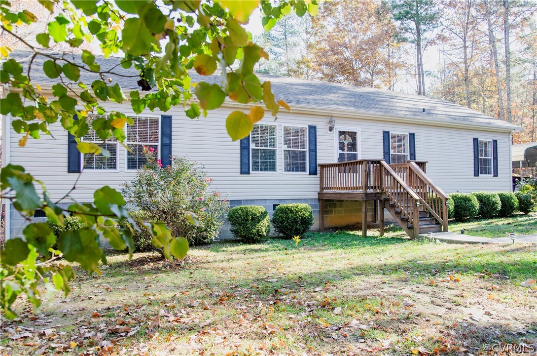 2861 Gold Mine Road Palmyra, VA 22963 - Photo 6 of 32 a front view of a house with a yard and potted plants