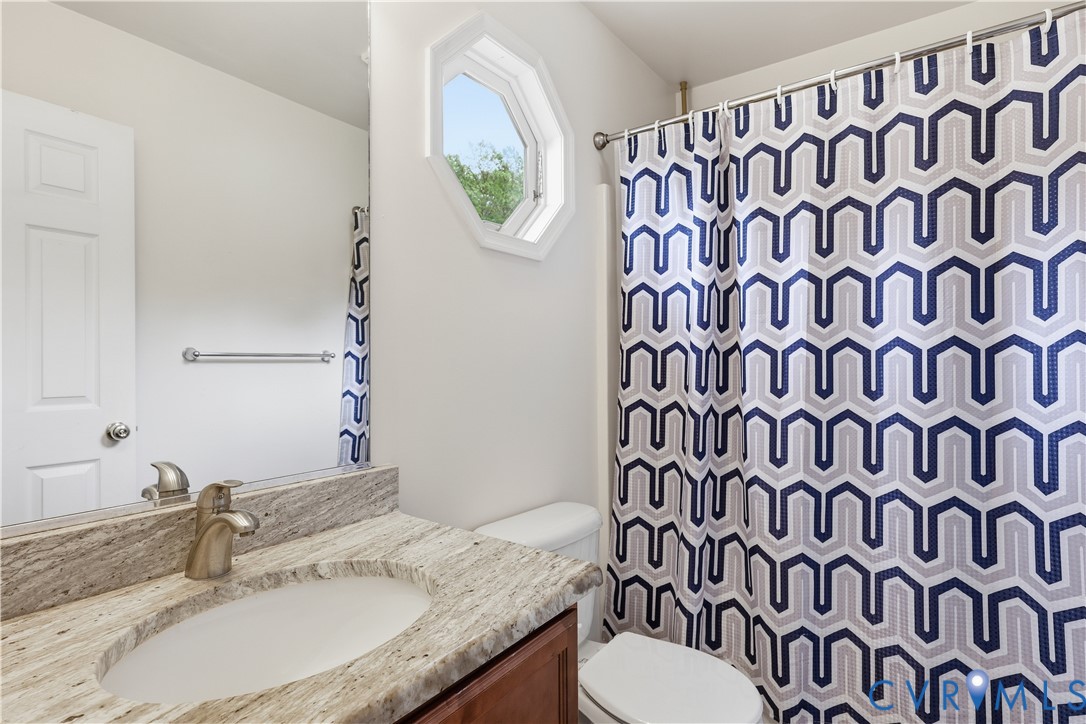 15490 Tyler Station Road Beaverdam, VA 23015 - Photo 23 of 45 Bathroom featuring a vanity with an undermount sin