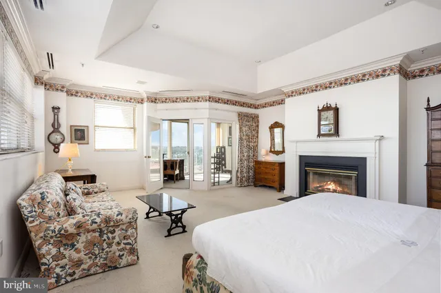 a white bath tub sitting next to a shower