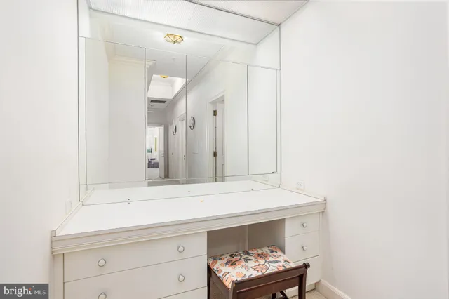 a bedroom with a bed and a tv on table