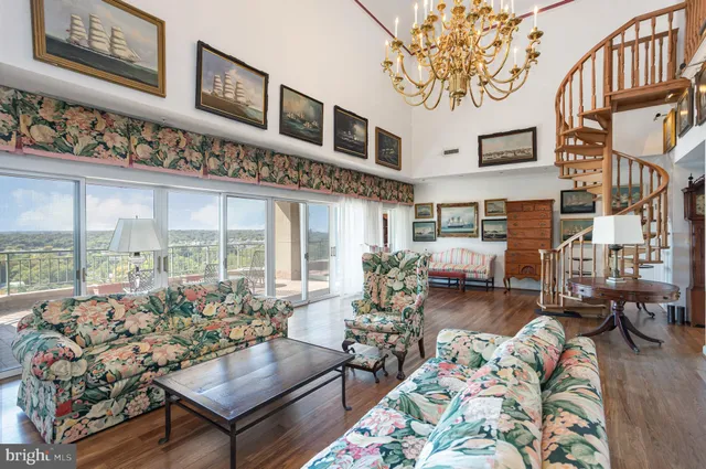 a living room with fireplace furniture and a wooden floor