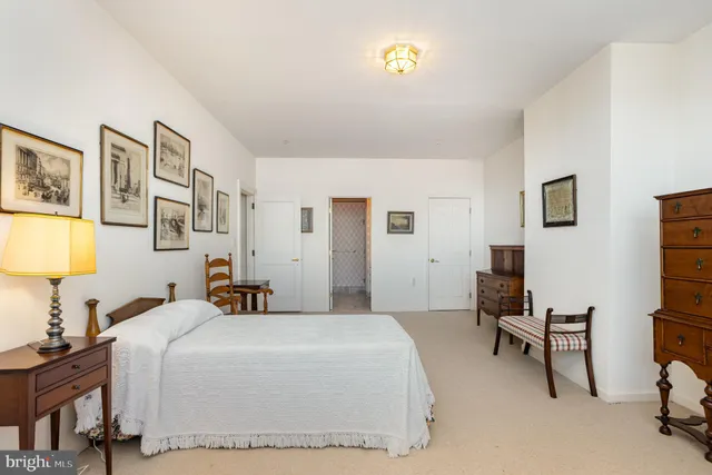 a large bathroom with a granite countertop tub sink and mirror