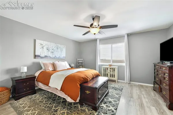 a bed room with a bed and a television