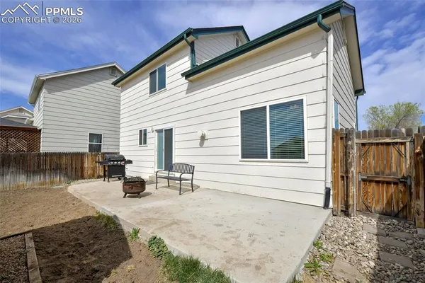 a view of backyard with a chair and couch