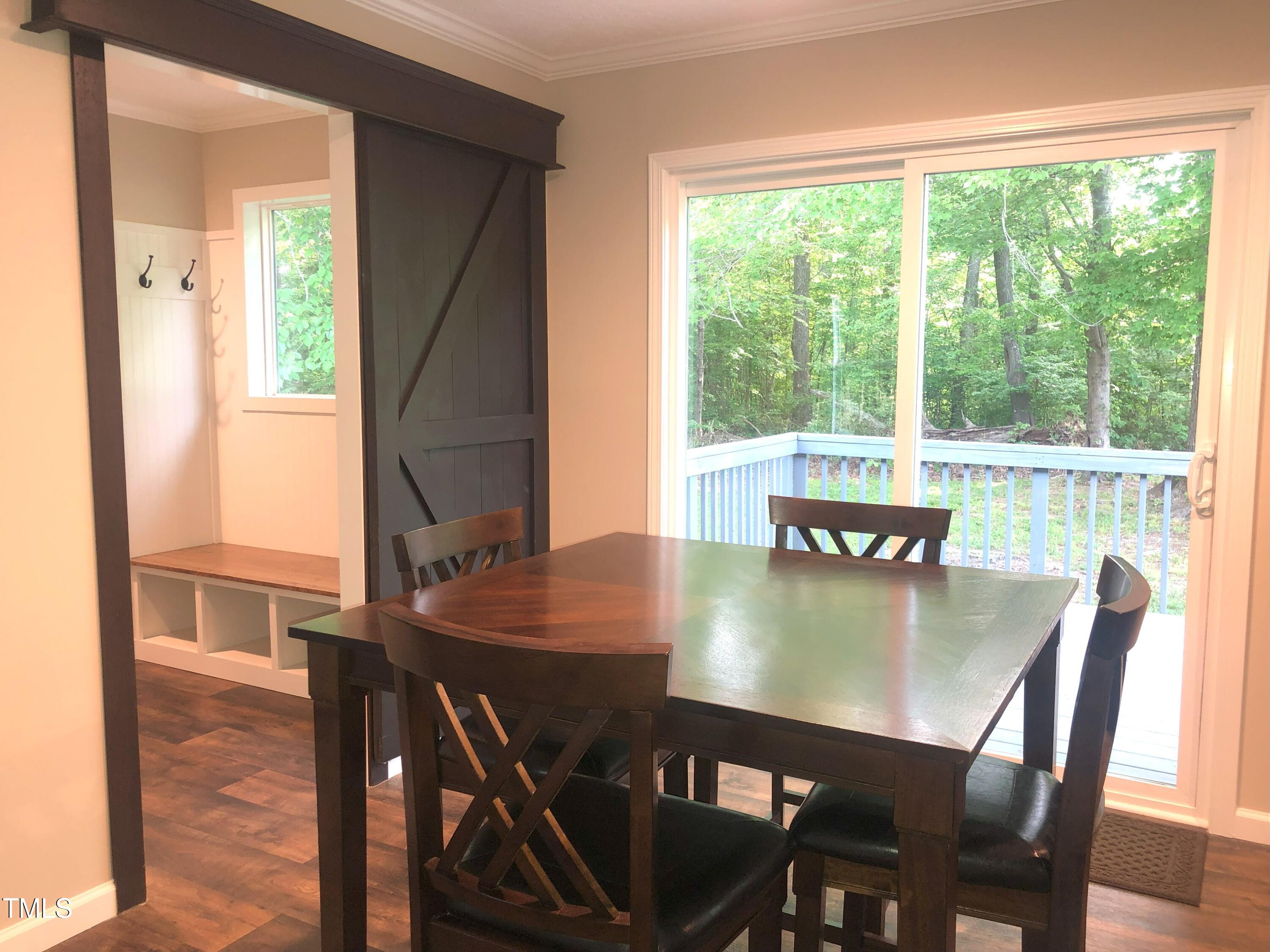550 Saplin Branch Road Timberlake, NC 27583 - Photo 11 of 33 a view of a dining room with furniture and a window