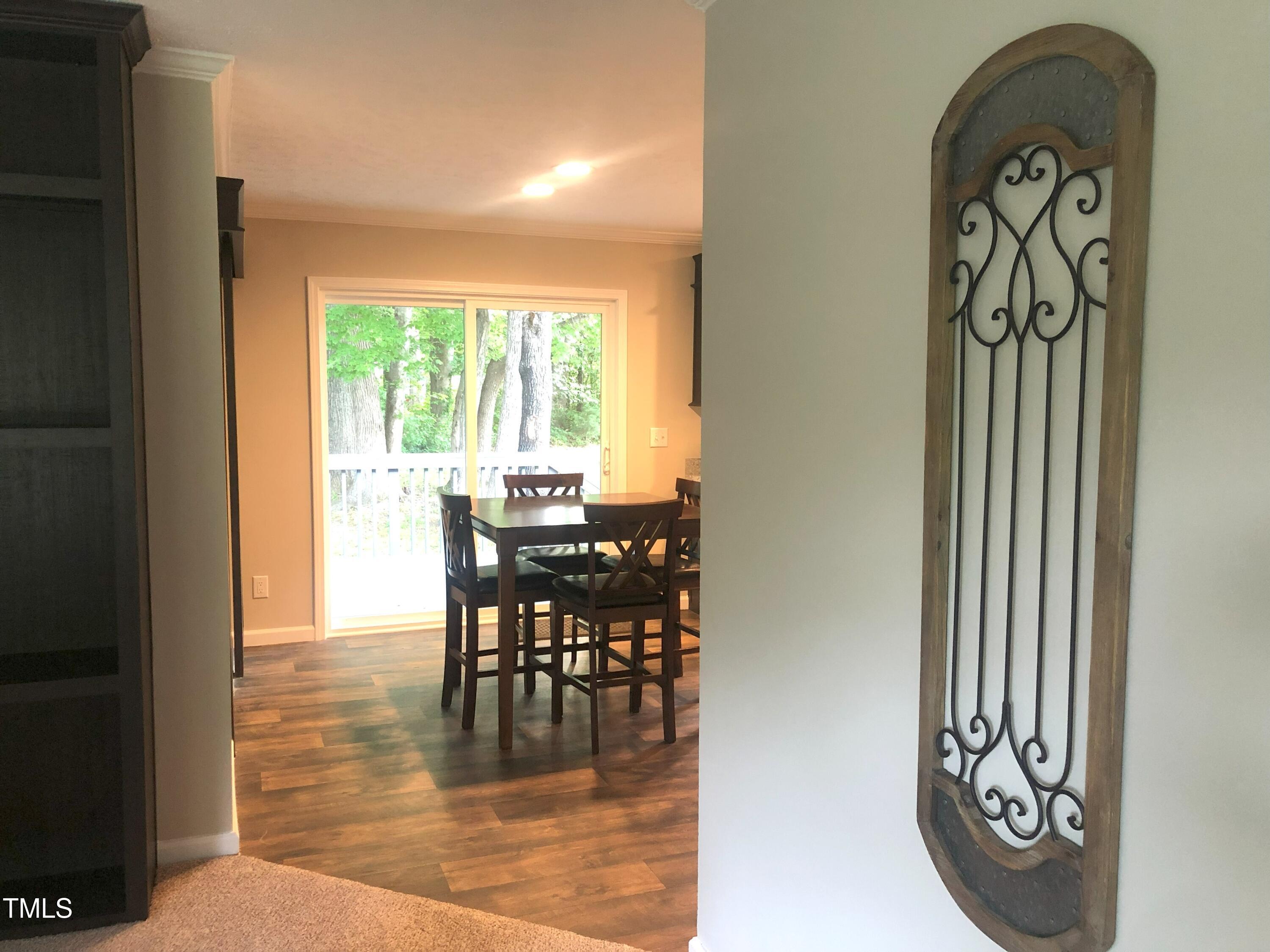 550 Saplin Branch Road Timberlake, NC 27583 - Photo 16 of 33 a view of a dining room with furniture window and outside view