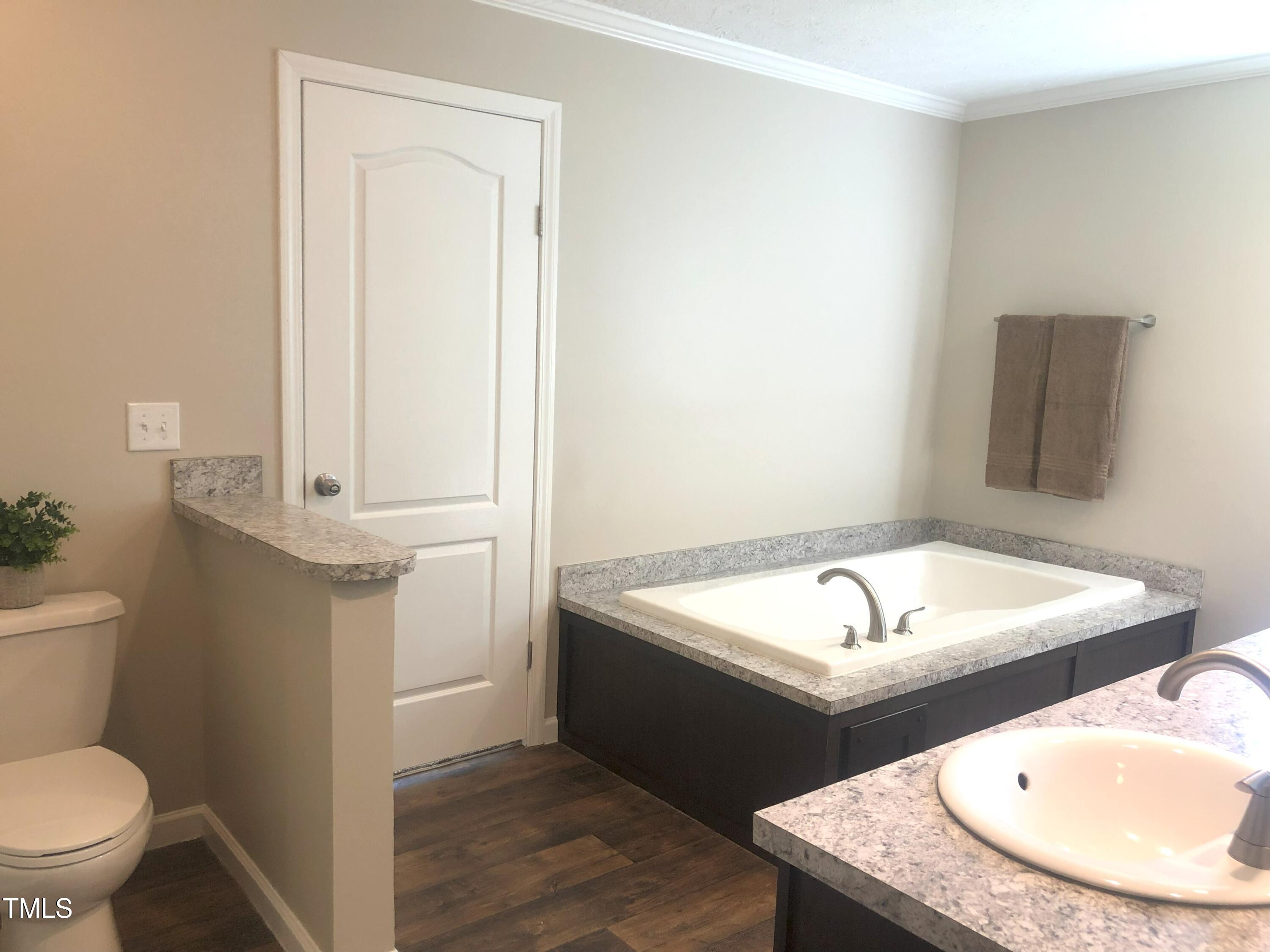 550 Saplin Branch Road Timberlake, NC 27583 - Photo 20 of 33 a bathroom with a sink and a toilet