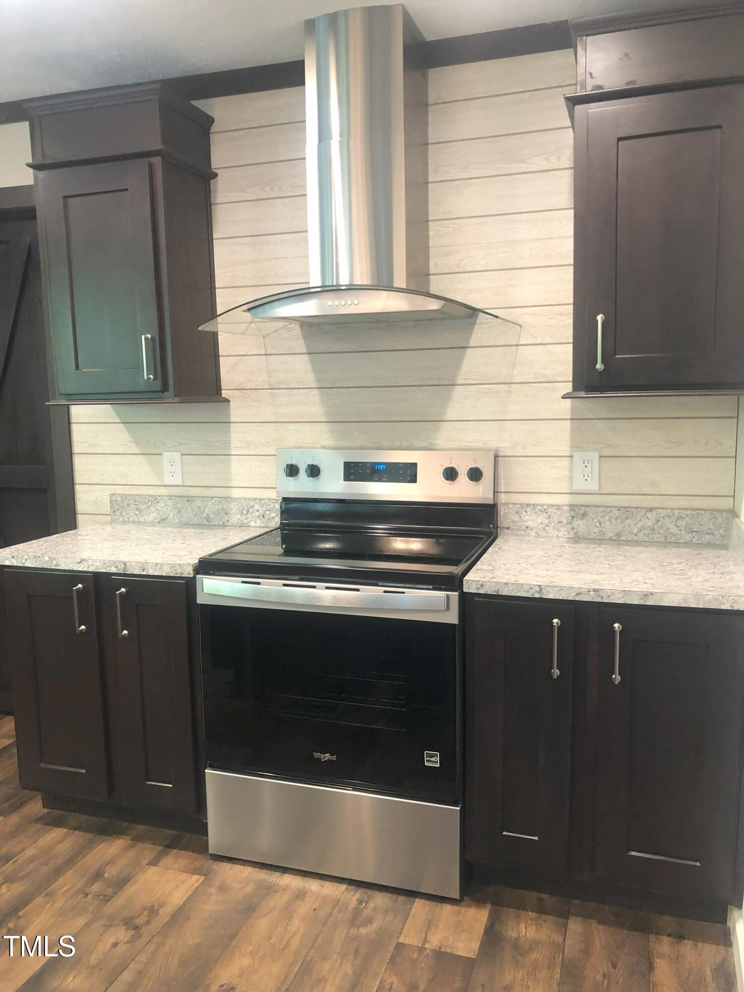550 Saplin Branch Road Timberlake, NC 27583 - Photo 9 of 33 a kitchen with a stove and a sink