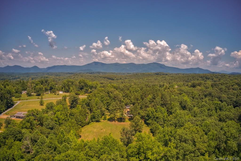 6074 Hunting Country Road Tryon, NC 28782 - Photo 1 of 34 a view of a lake in middle of the town