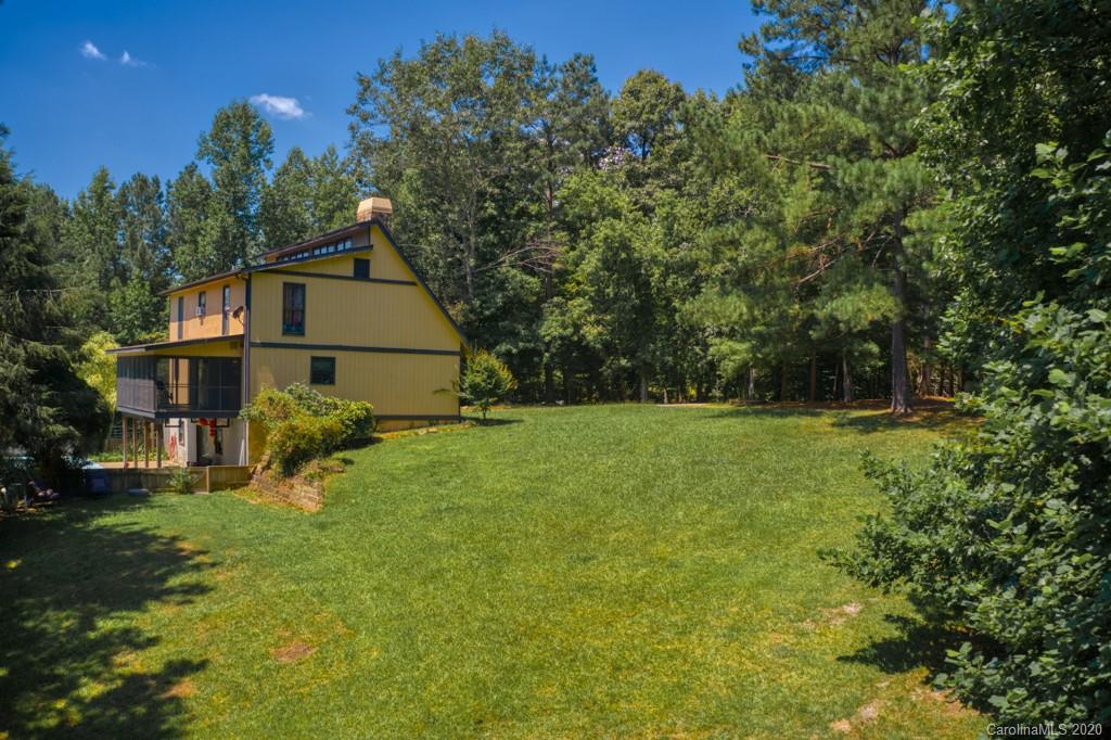 6074 Hunting Country Road Tryon, NC 28782 - Photo 4 of 34 a view of a house with a yard