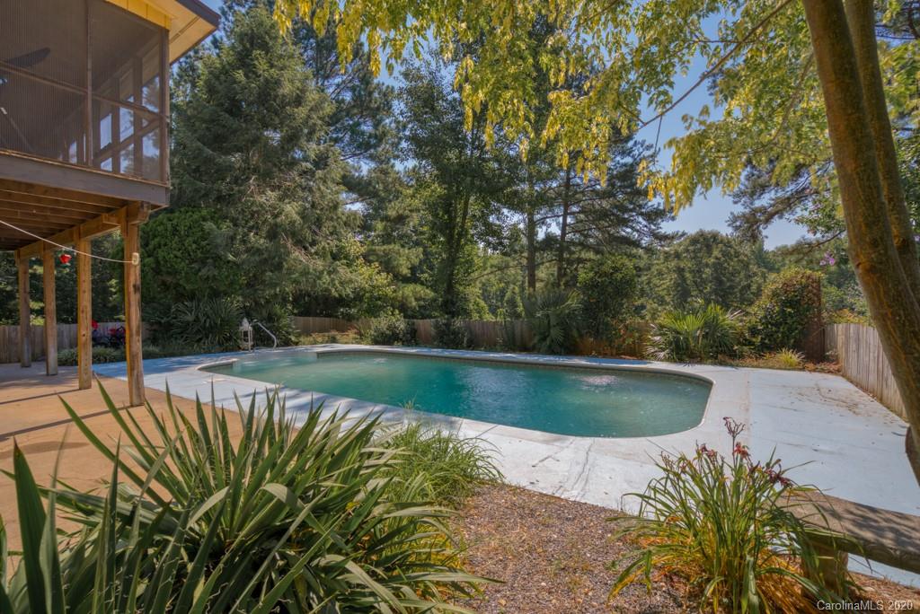 6074 Hunting Country Road Tryon, NC 28782 - Photo 7 of 34 a view of a swimming pool with a patio